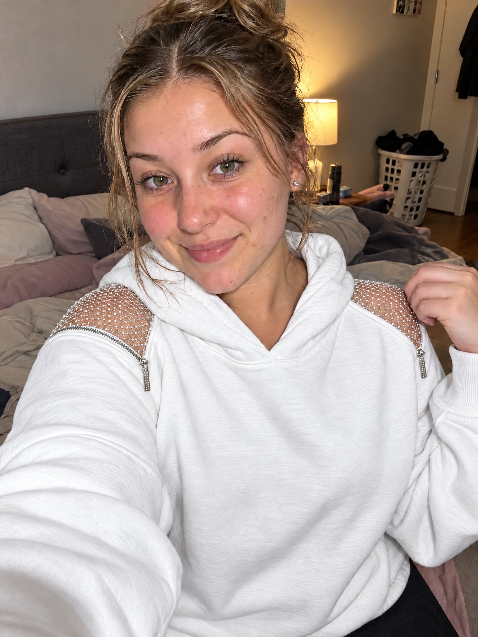 Close-up front selfie showing the White Backless Hoodie.